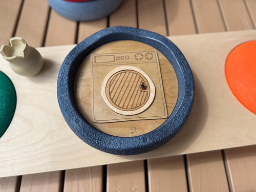 A wooden lid in a form of a washer inside  Stapelstein stepping stone 